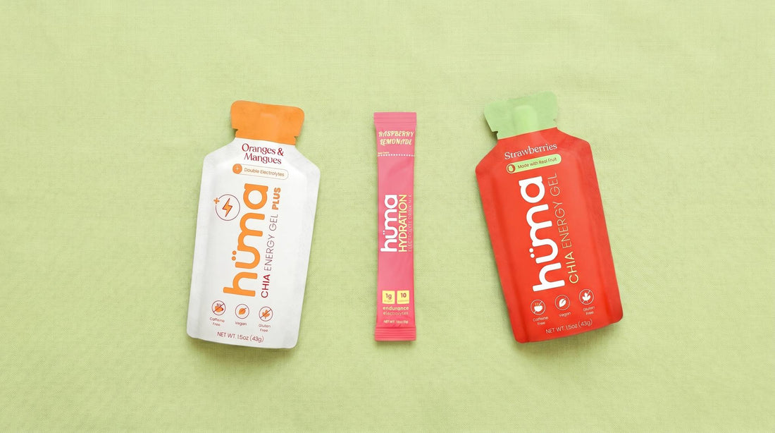 Huma PLUS Oranges and Mangoes gel, Huma Hydration Raspberry Lemonade drink mix, and Huma Original Strawberries gel on a pastel lime-green linen background
