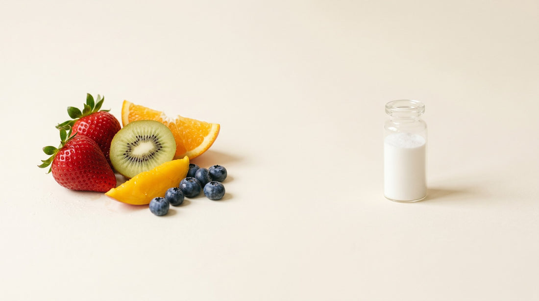 Fresh real fruit beside a small vial of white maltodextrin powder - real food versus a processed, synthetic carbohydrate.